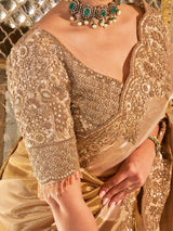 Gold shimmer tissue silk saree with subtle textured drape