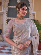 Champagne gold shimmer tissue silk saree with peacock motifs