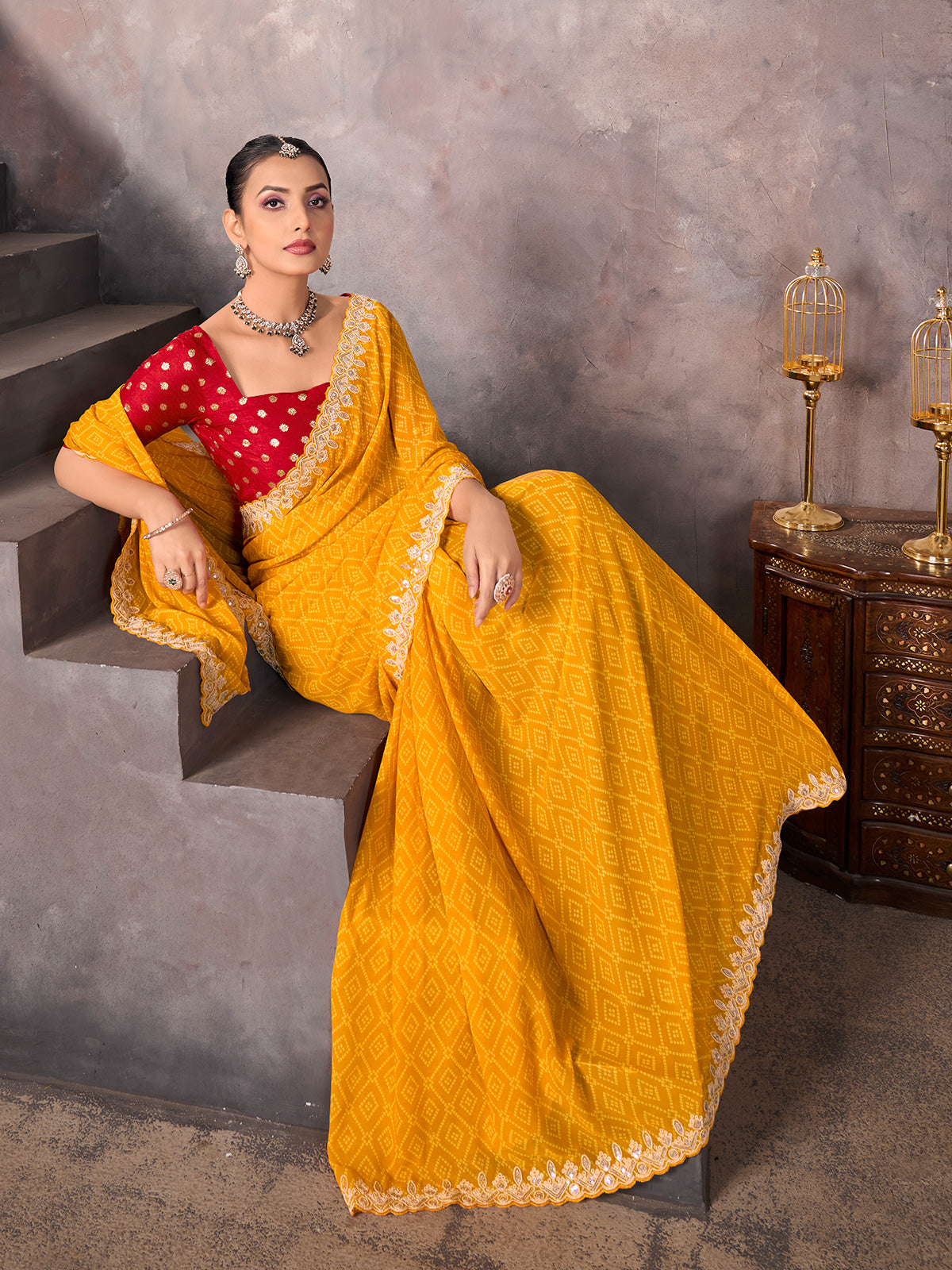 Mustard yellow georgette bandhej saree with sequins