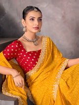 Mustard yellow georgette bandhej saree with sequins