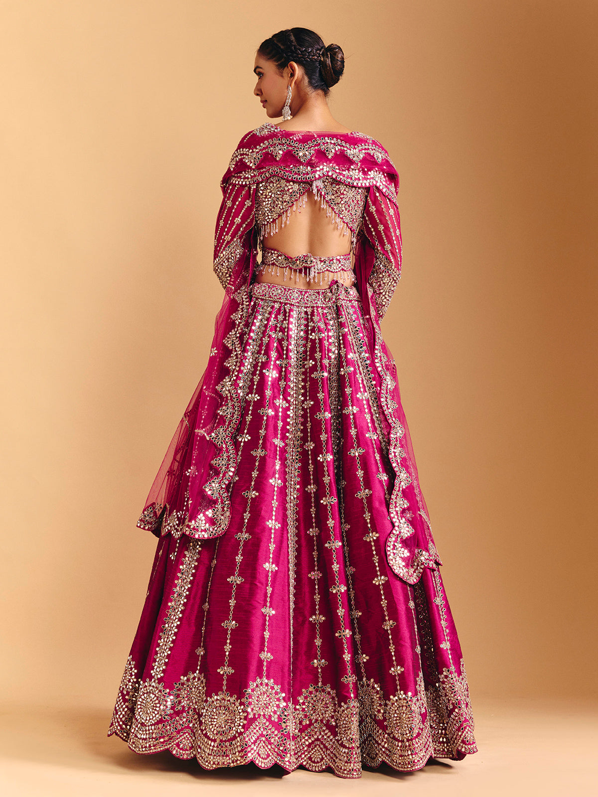 Deep rani pink raw silk lehenga choli with mirror embellishments