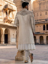 Cream raw silk sherwani with regal zardosi and sequins work