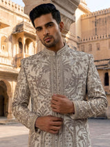 Cream raw silk sherwani with regal zardosi and sequins work