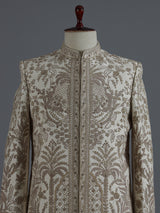 Cream raw silk sherwani with regal zardosi and sequins work