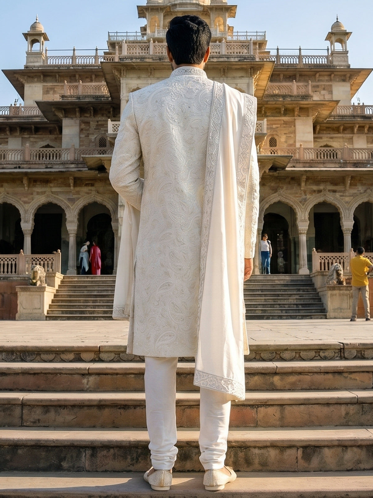 White raw silk sherwani with intricate embroidery and stone detailing
