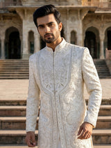 White raw silk sherwani with intricate embroidery and stone detailing