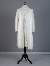 White raw silk sherwani with intricate embroidery and stone detailing