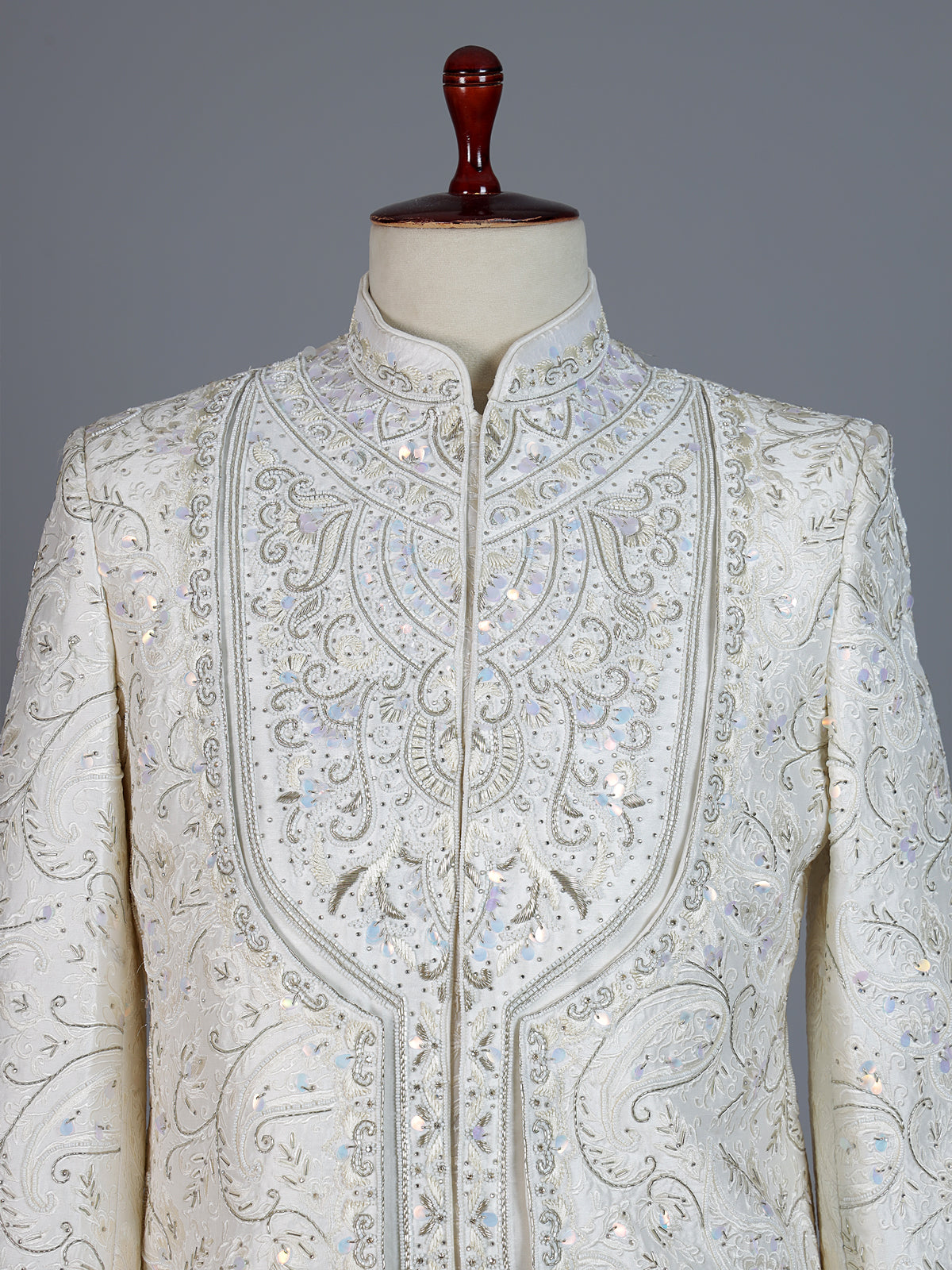 White raw silk sherwani with intricate embroidery and stone detailing