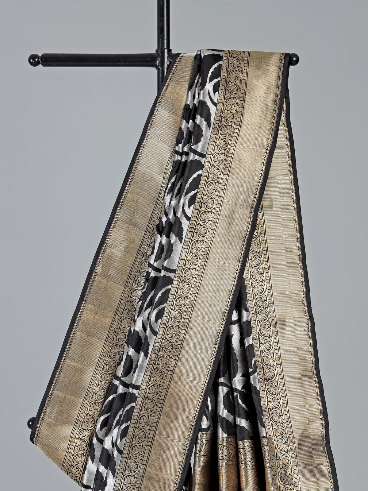 Black banarasi silk saree adorned with elegant silver zari detailing