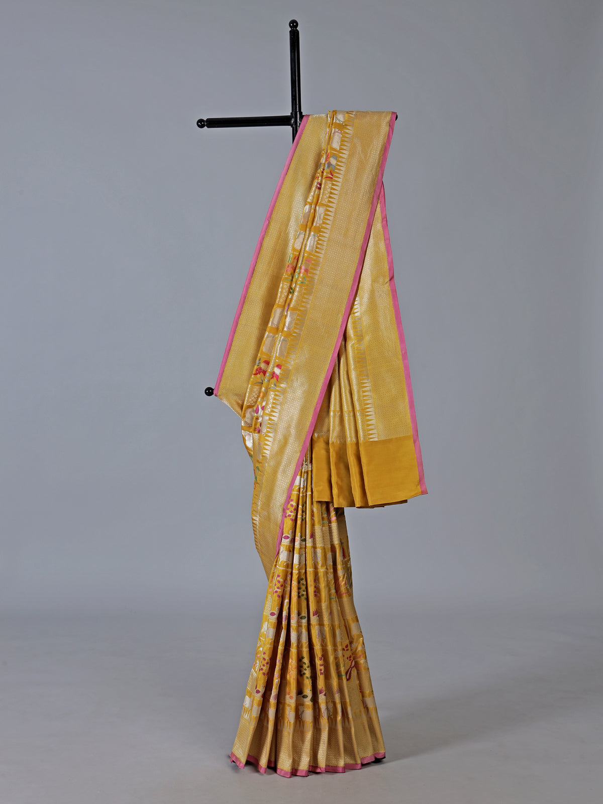 Yellow banarasi silk festive saree enhanced with shimmering zari accents