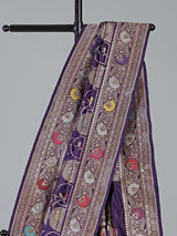 Purple banarasi silk saree featuring detailed zari work for weddings