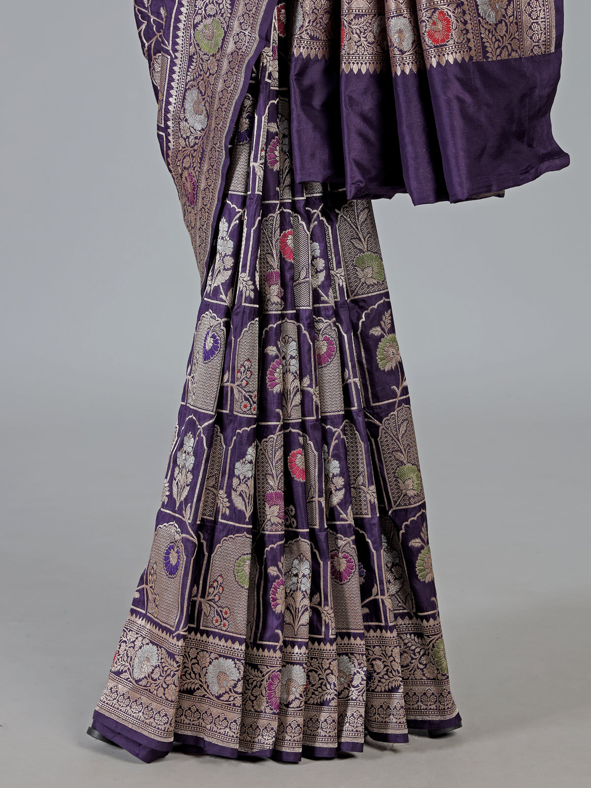 Purple banarasi silk saree featuring detailed zari work for weddings