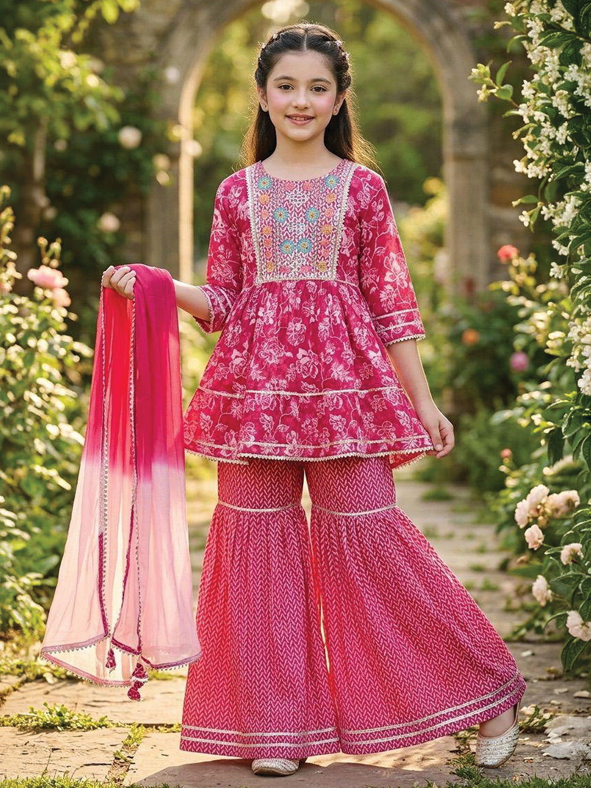 Rani pink cotton sharara suit with floral prints