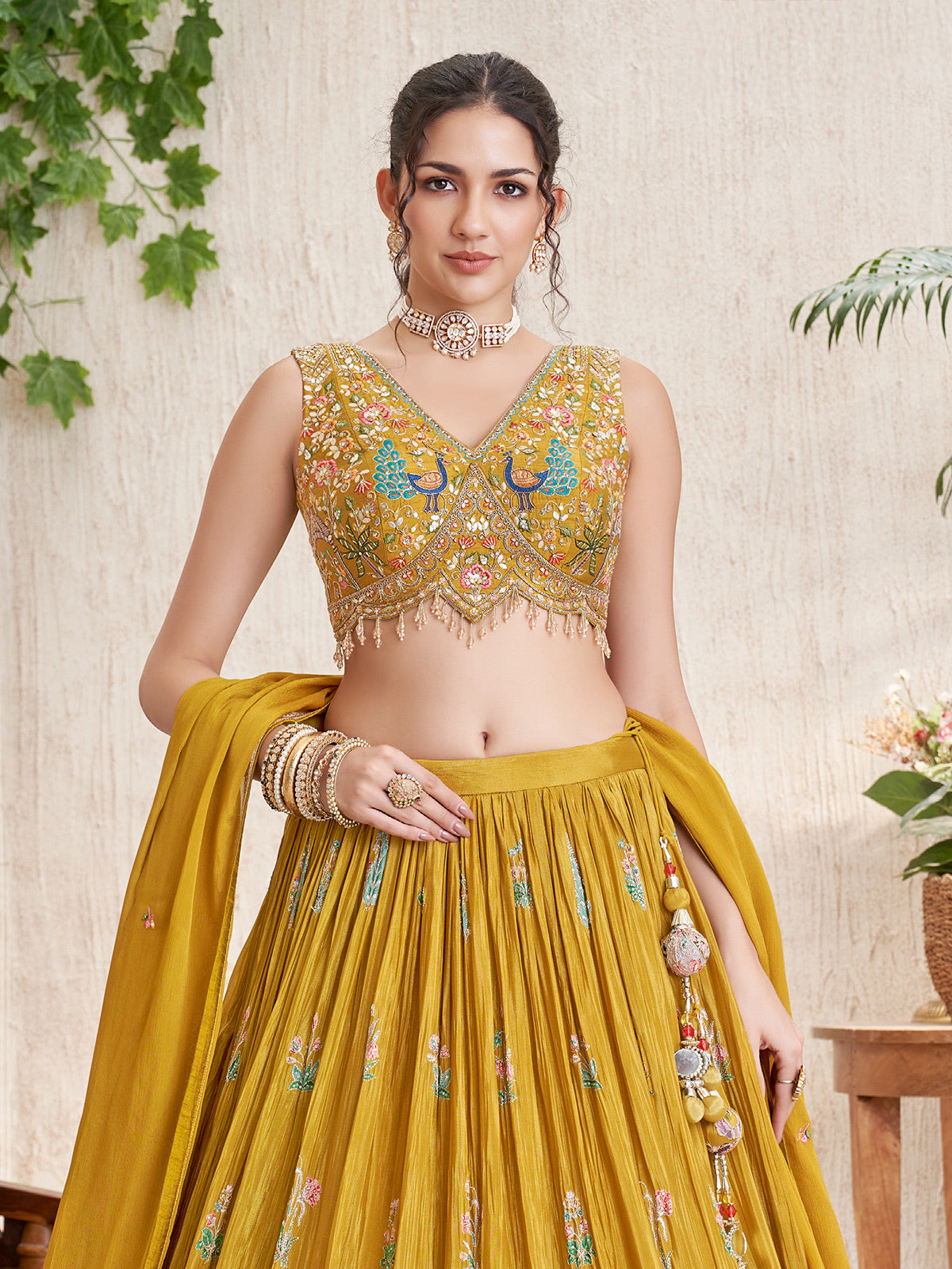 Mustard silk lehenga choli with peacock and deer motifs