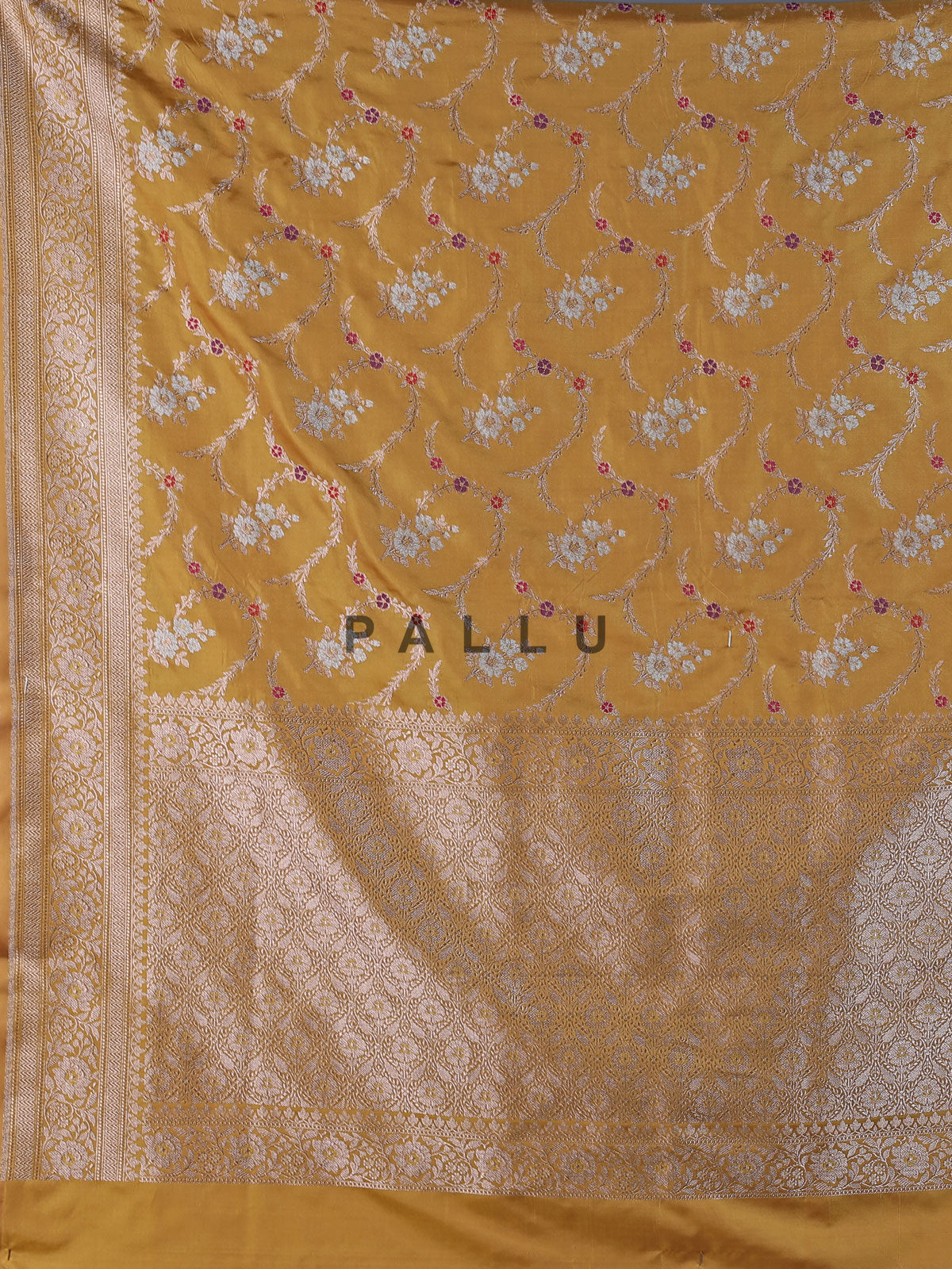 Dusty yellow banarasi silk saree with floral zari design