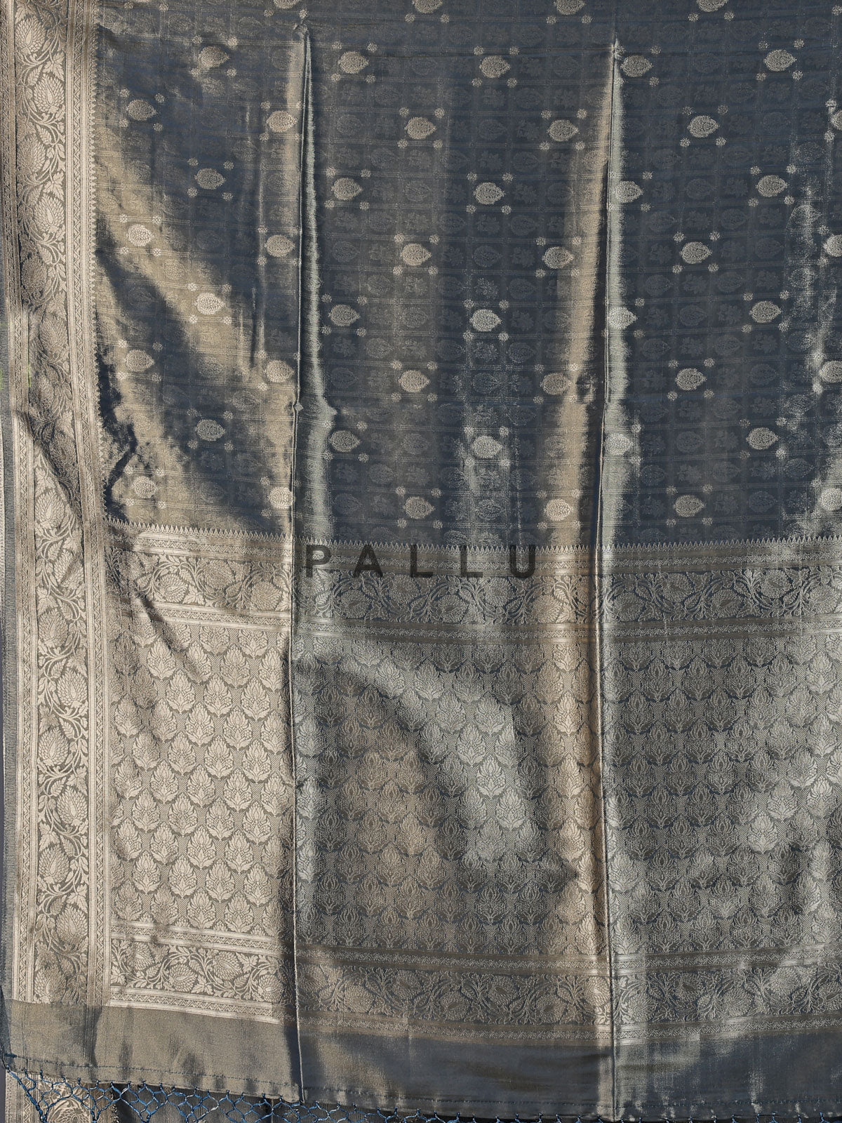 Grey tissue silk saree with refined butti and detailed pallu