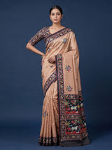 Soft peach art tusser silk saree with artistic prints and rich pallu