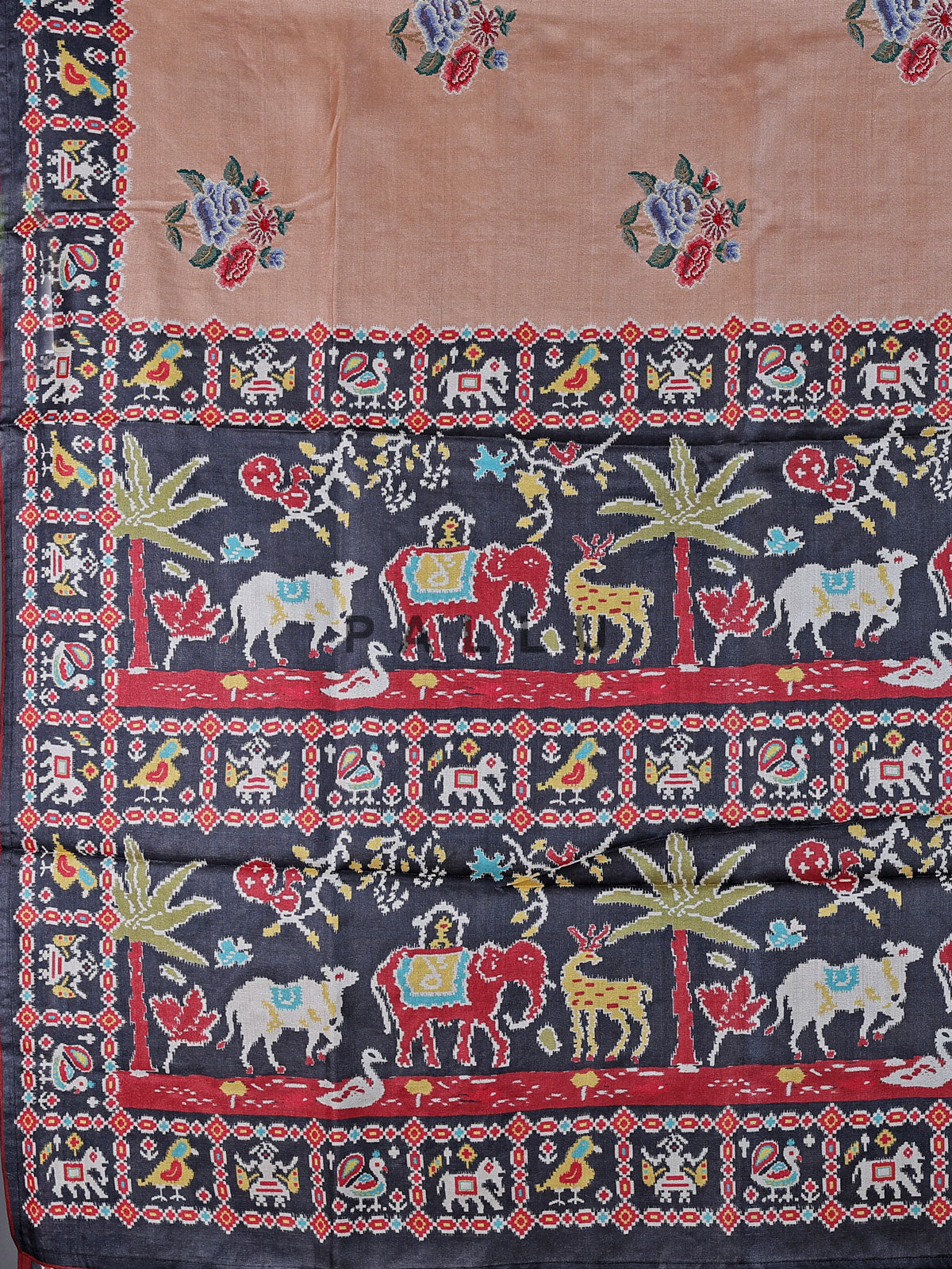 Soft peach art tusser silk saree with artistic prints and rich pallu