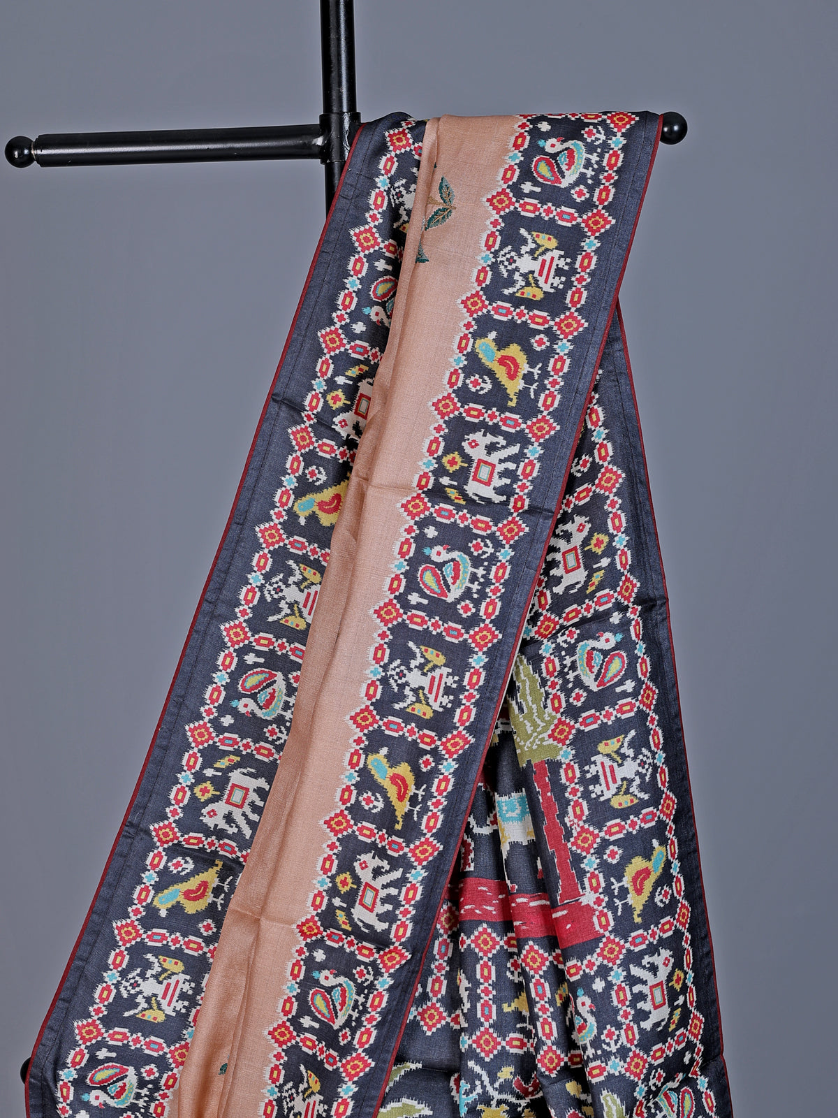 Soft peach art tusser silk saree with artistic prints and rich pallu