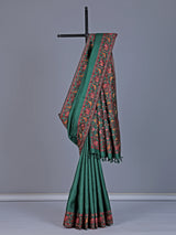 Deep green tusser silk saree with intricate animal motif artistry