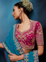 Blue silk saree paired with a striking red blouse