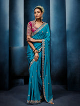 Blue silk saree paired with a striking red blouse