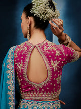 Blue silk saree paired with a striking red blouse