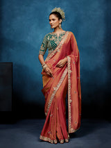 Peach tissue silk saree with intricate heavy work