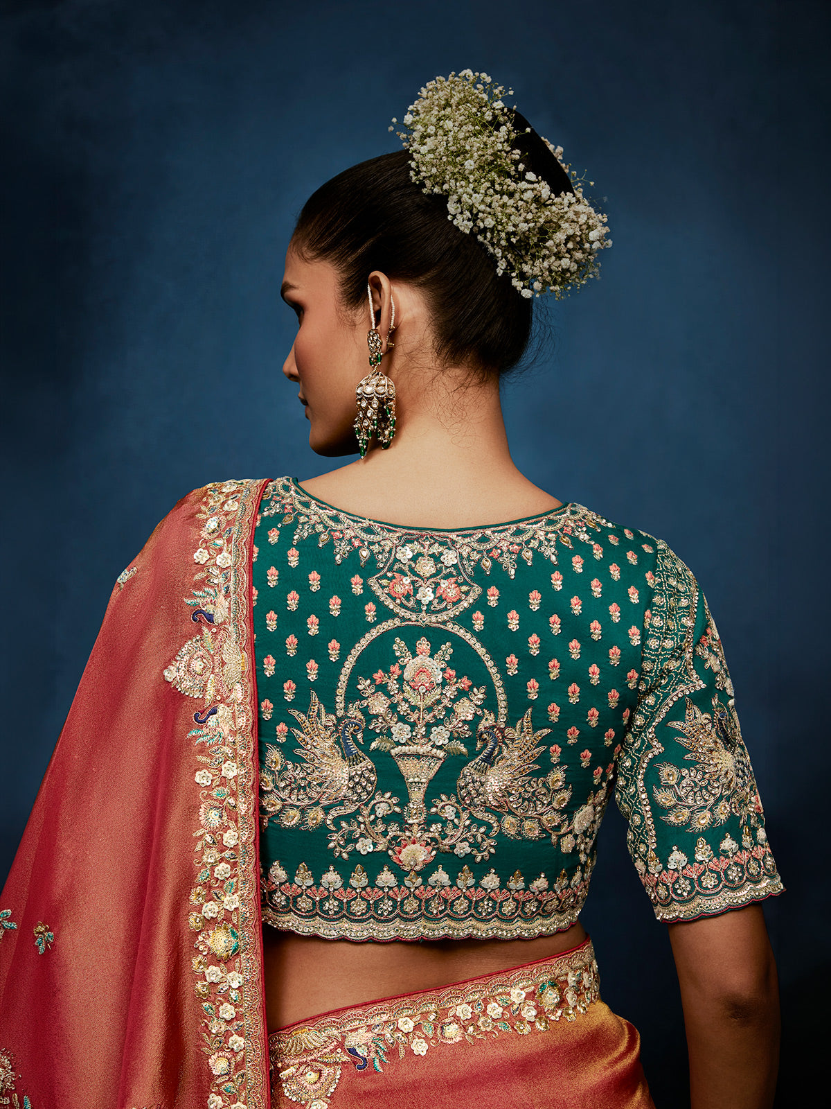 Peach tissue silk saree with intricate heavy work