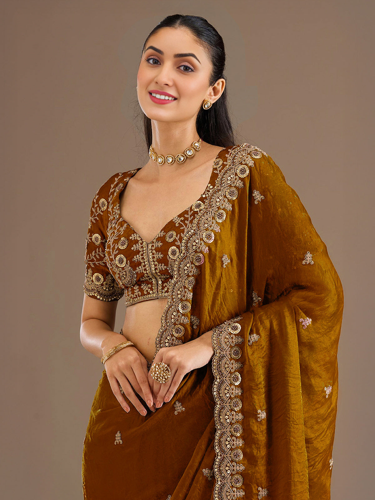 Gold tissue saree with cutdana and sequins work