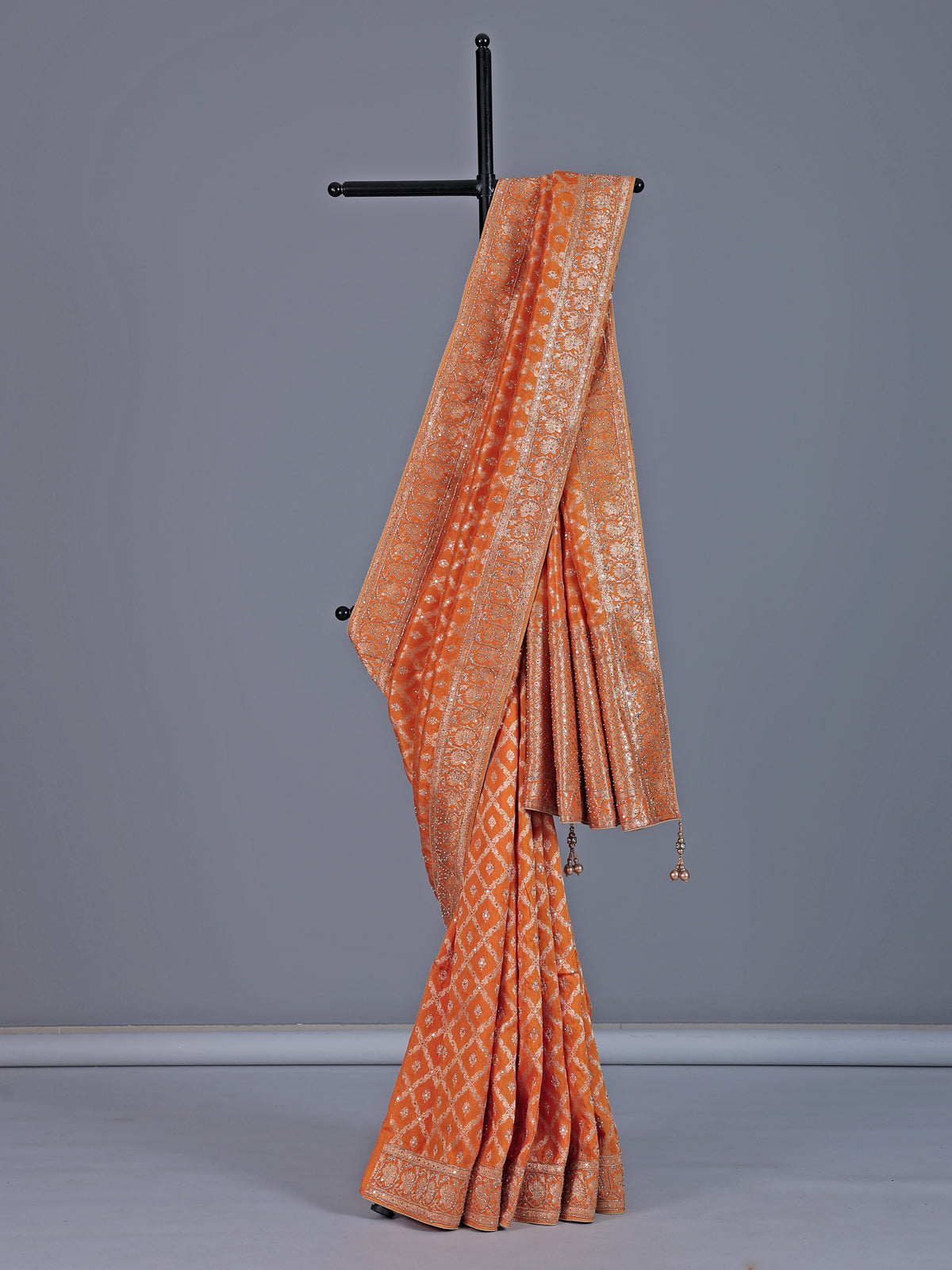 Light orange dola silk saree with zari jal detailing
