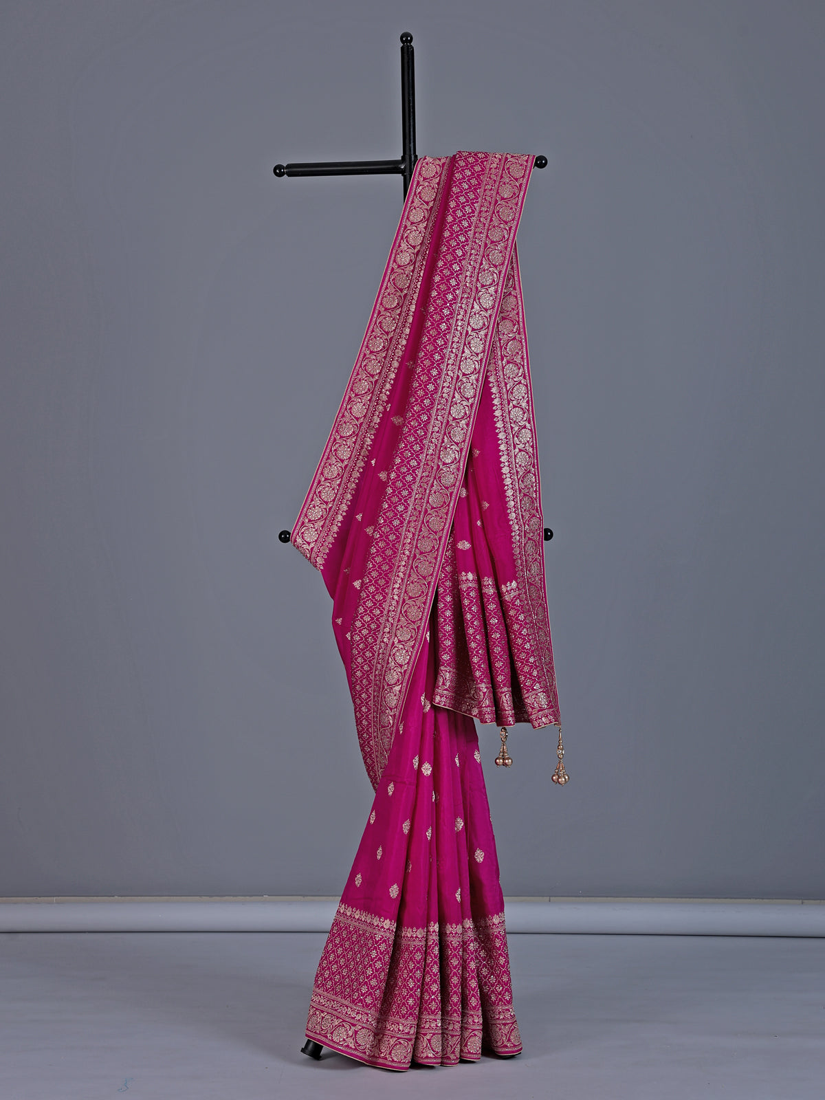 Rani pink dola silk saree with festive zari butti