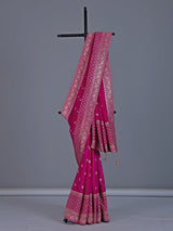 Rani pink dola silk saree with festive zari butti