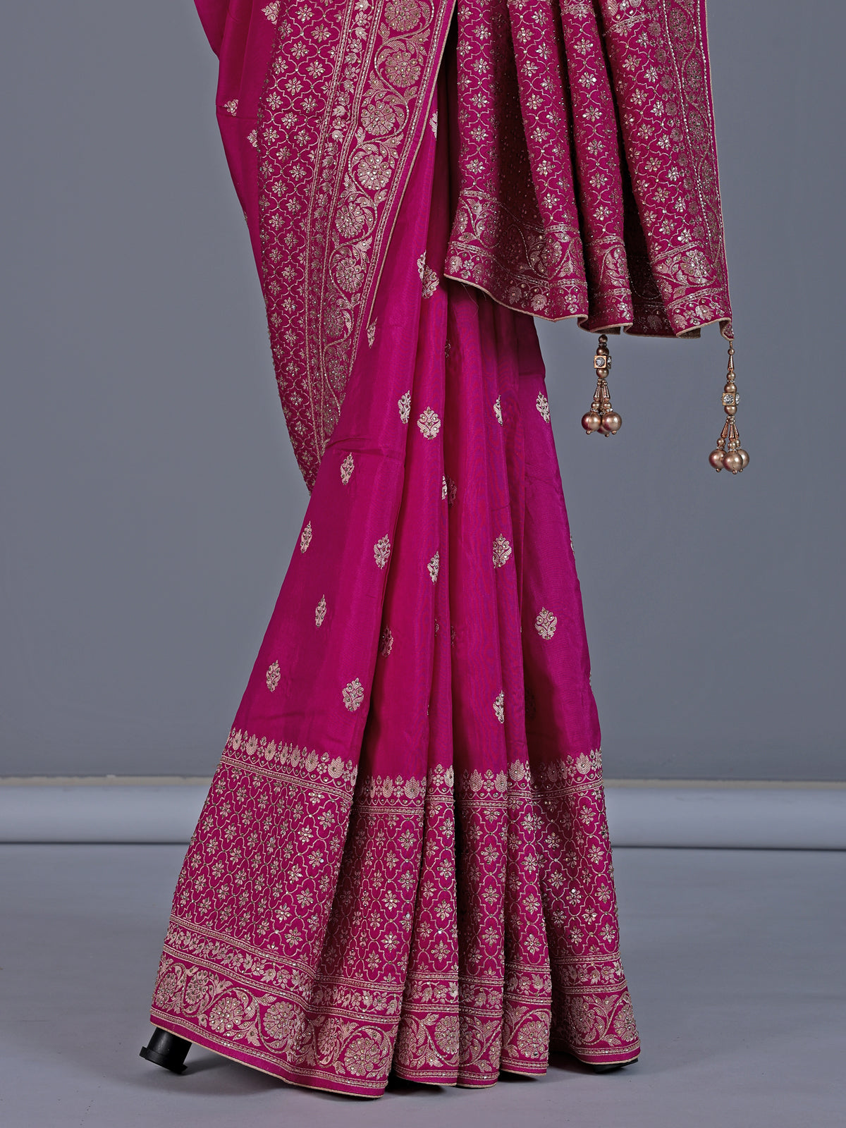 Rani pink dola silk saree with festive zari butti