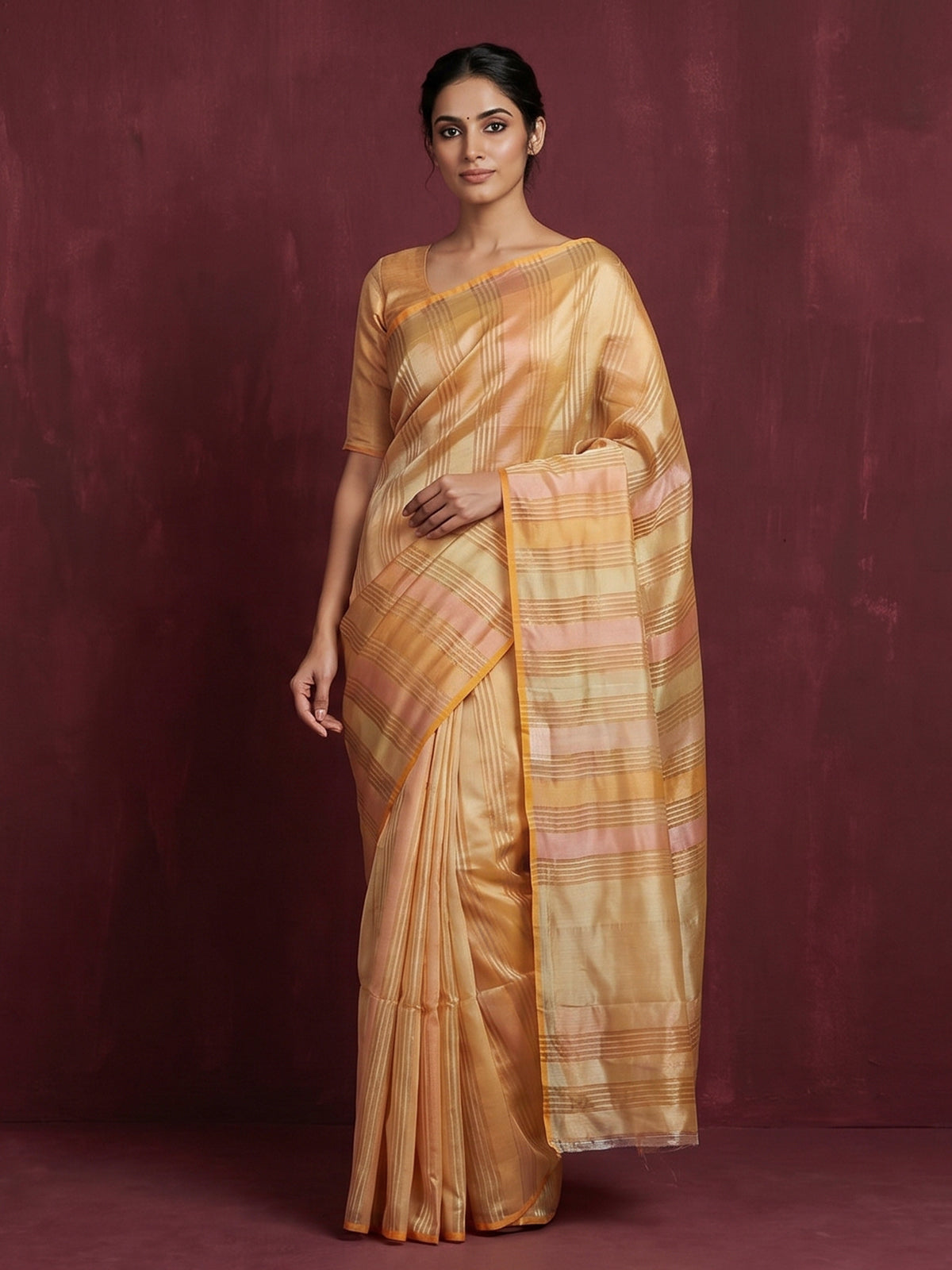 Peach striped organza saree for elegant sangeet evenings