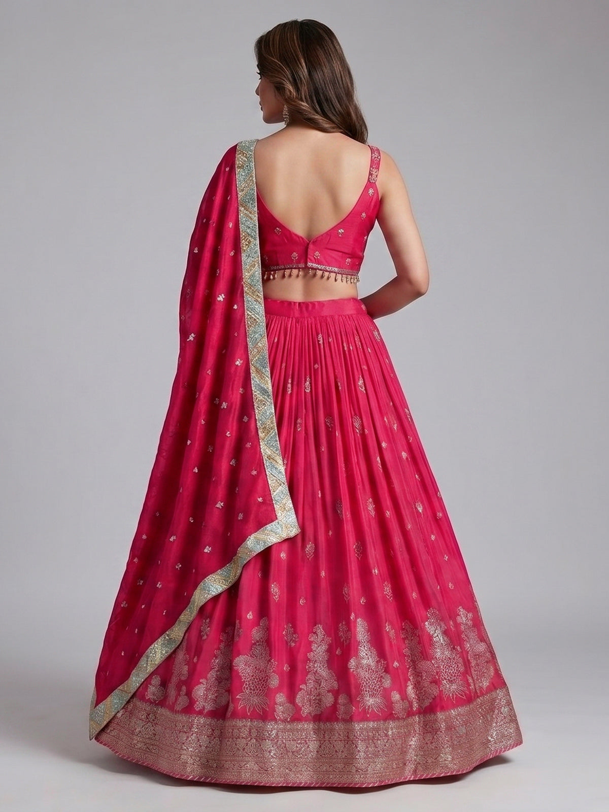 Rani pink silk lehenga choli with zardosi tassel detailing