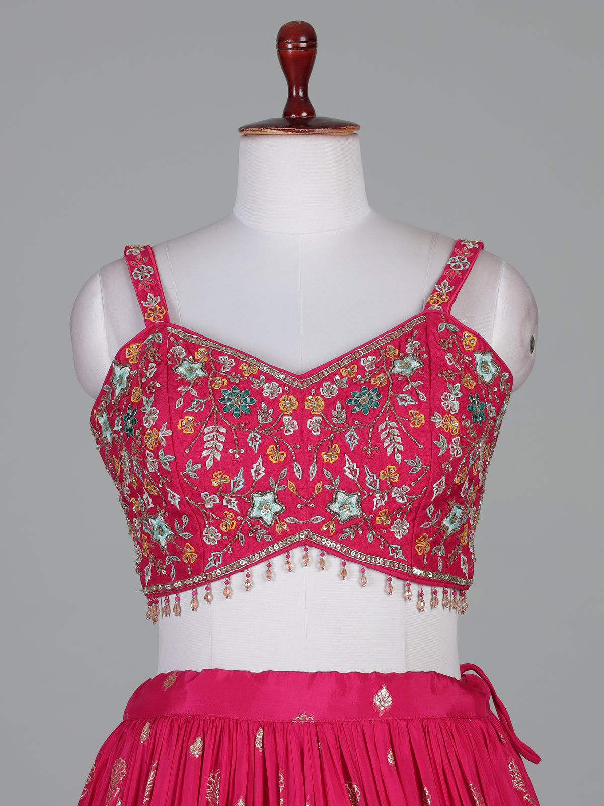 Rani pink silk lehenga choli with zardosi tassel detailing