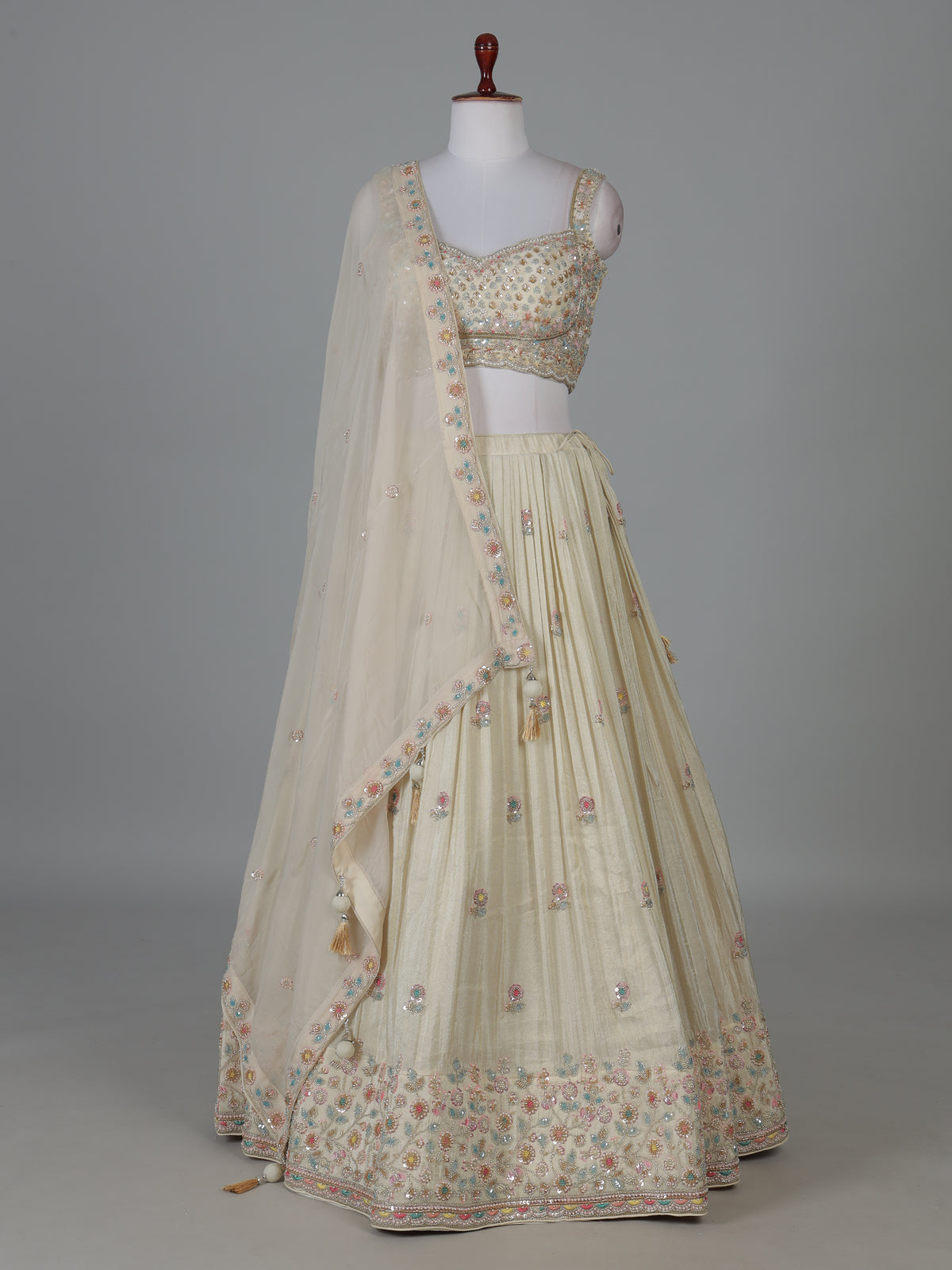Cream silk lehenga choli with delicate embroidery