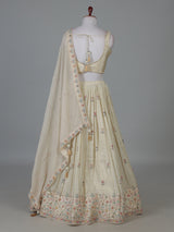 Cream silk lehenga choli with delicate embroidery