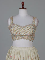 Cream silk lehenga choli with delicate embroidery