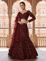 Maroon net lehenga choli with intricate handwork