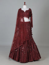 Maroon net lehenga choli with intricate handwork