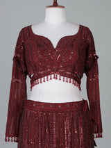 Maroon net lehenga choli with intricate handwork