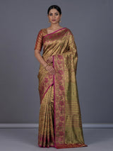 Golden Kanjivaram silk saree with floral motifs