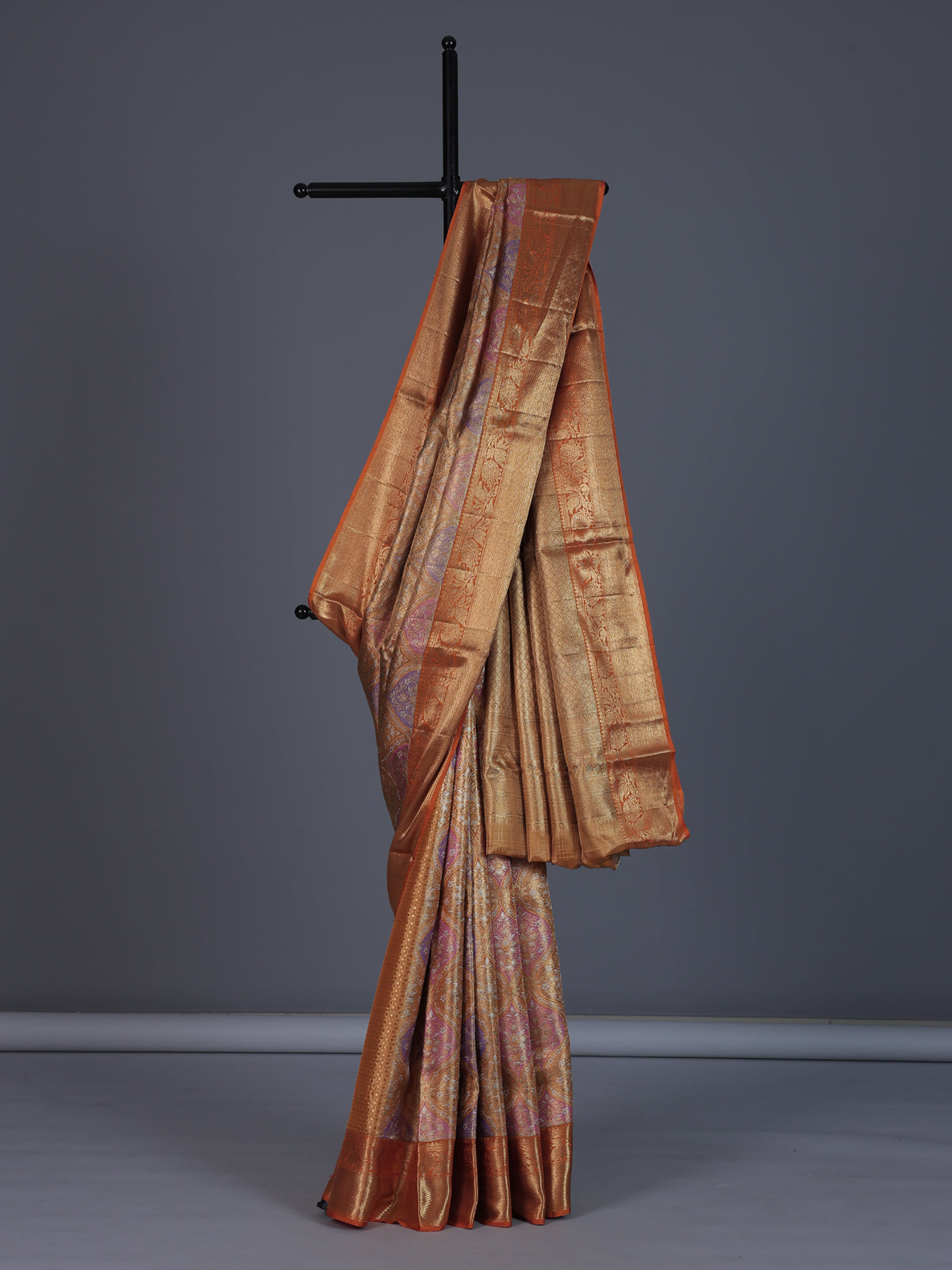 Golden Kanjivaram silk saree for weddings with ethnic motifs