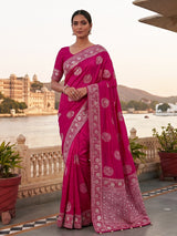 Pink wedding wear dola silk saree with rich embellished border