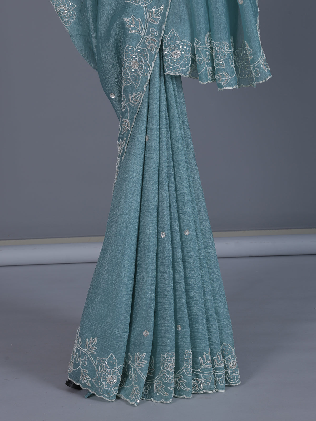 Firozi blue crushed tissue saree with radiant sequins elegance