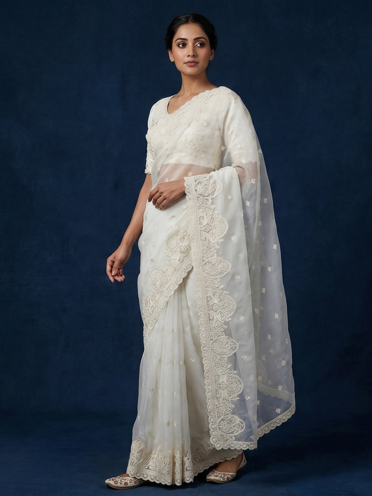 White organza tissue saree with graceful embroidered festive elegance
