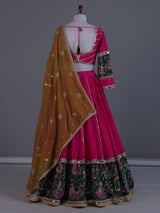 Rani pink mirror adorned festive lehenga grandeur