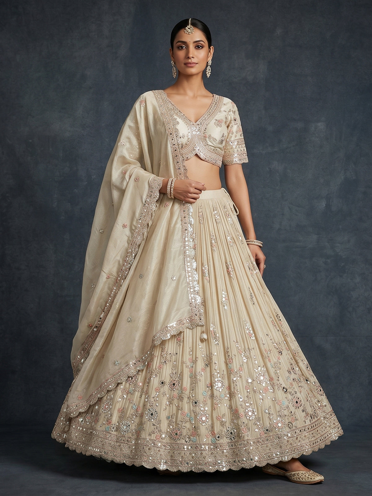 Cream scalloped masterpiece lehenga with royal elegance